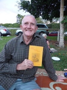 Ian and his book, pizza night, Bexhill NSW (Louise Kenward, 2014)